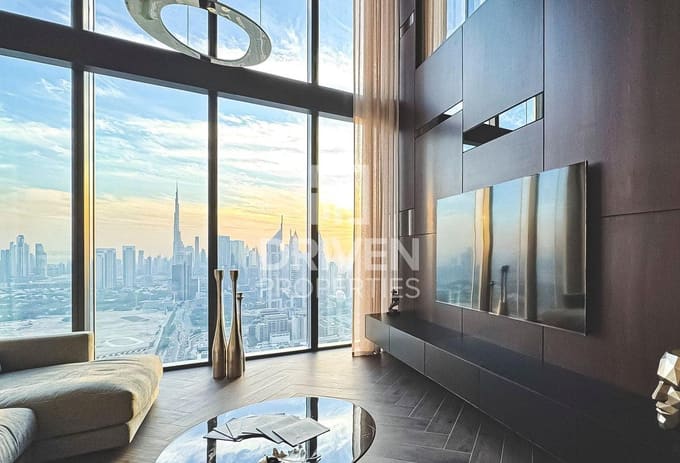 One Za’abeel listing photograph of the double-height living room overlooking Dubai