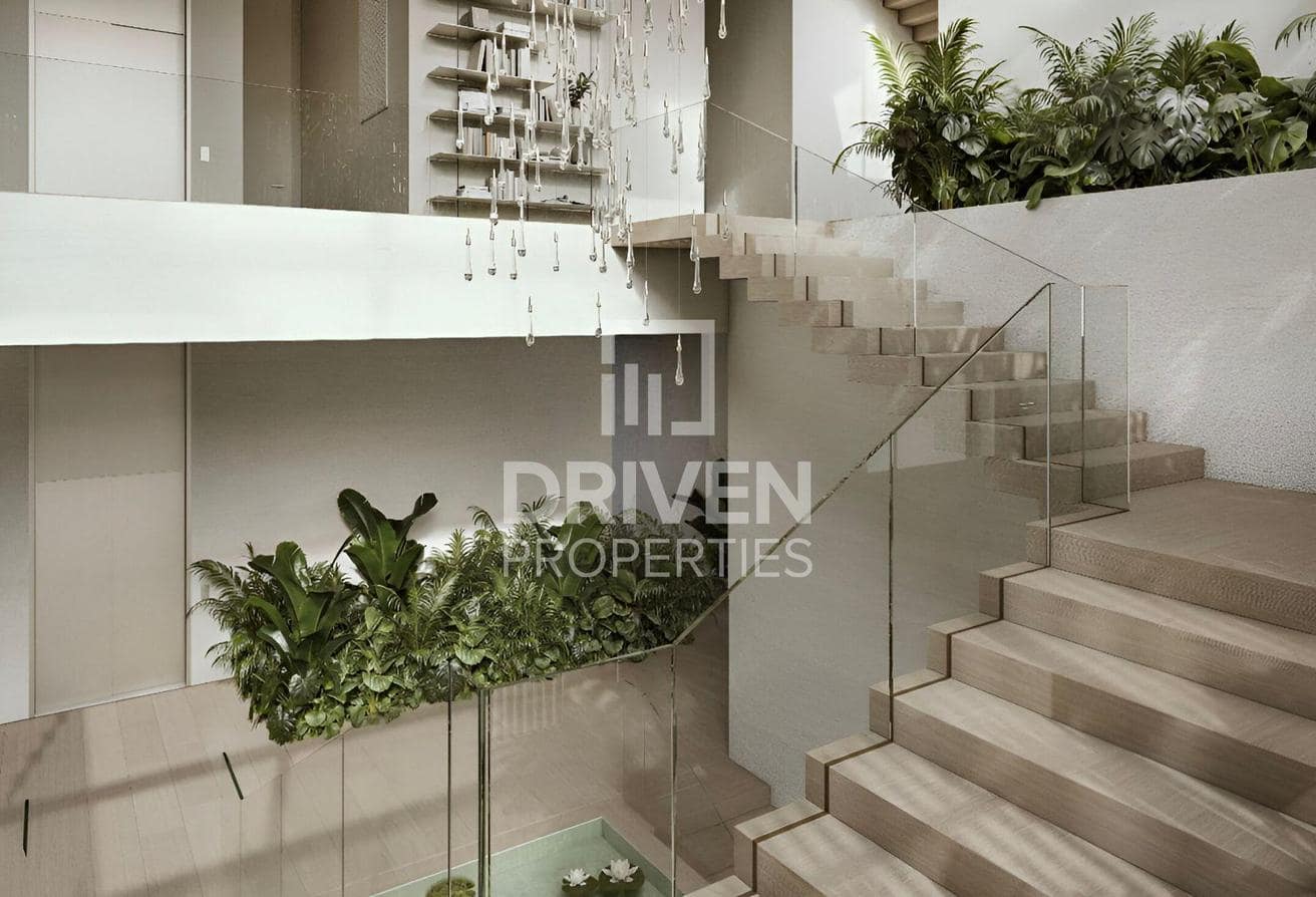 Altissima listing image of the sculptural staircase and interior planting