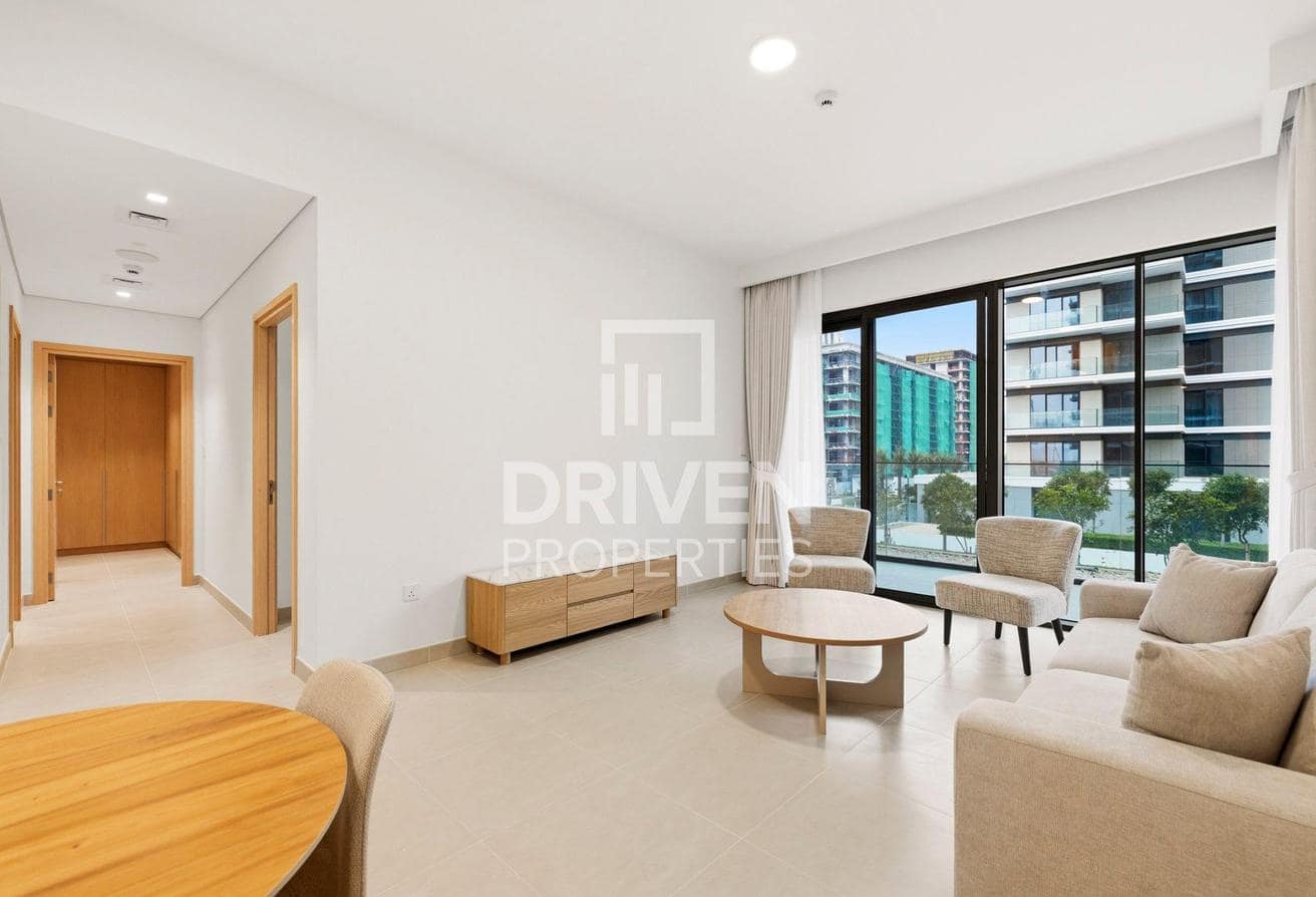 Mina Rashid listing photograph of a furnished living room opening onto a terrace