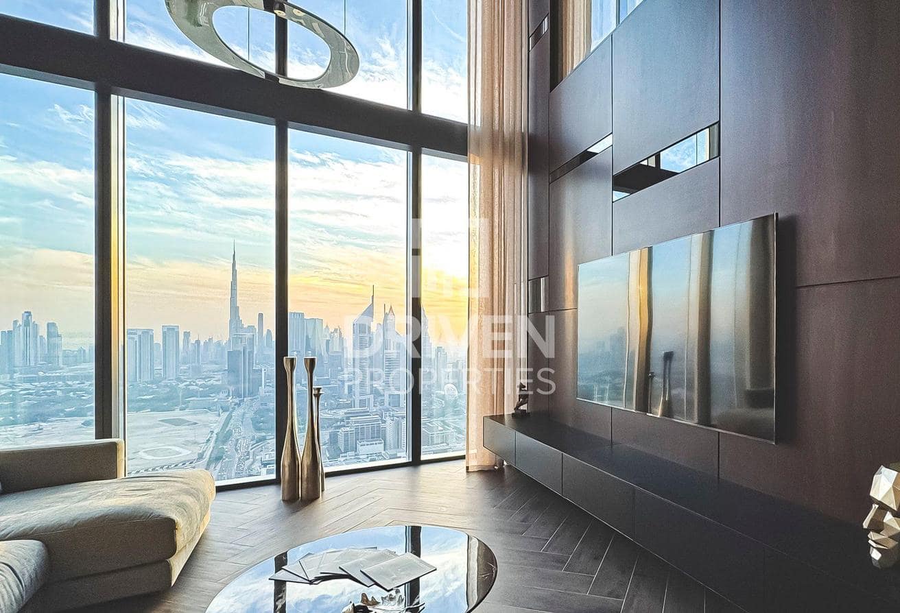 One Za’abeel listing photograph of the double-height living room overlooking Dubai