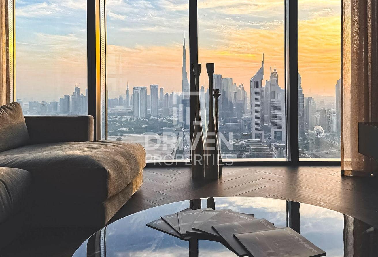 One Za’abeel listing photograph of the lounge with floor-to-ceiling skyline views